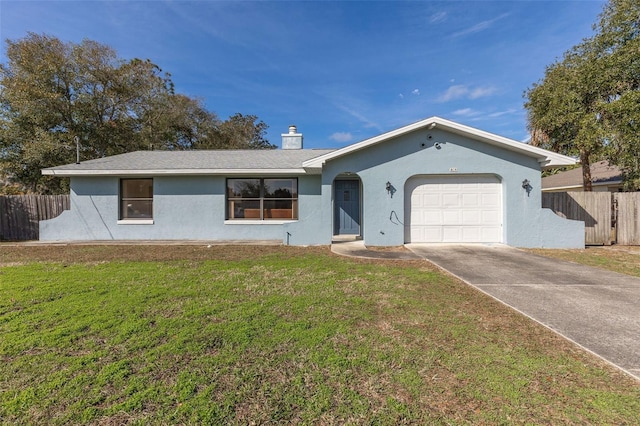 ranch-style home featuring a garage and a front yard