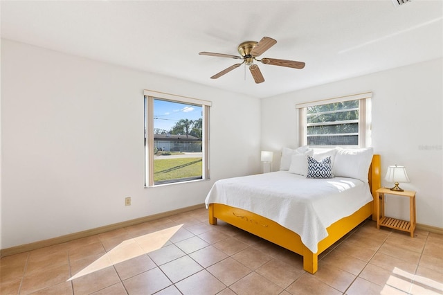 bedroom featuring tile patterned flooring and ceiling fan