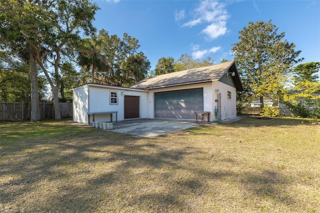 garage featuring a lawn