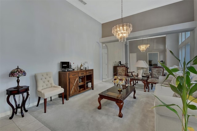 living room featuring an inviting chandelier and light tile patterned floors