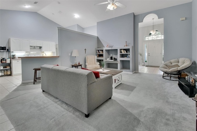 living room featuring light tile patterned flooring, ceiling fan, and high vaulted ceiling