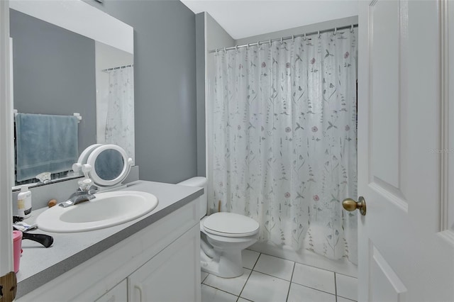 full bathroom with vanity, toilet, tile patterned flooring, and shower / bath combo