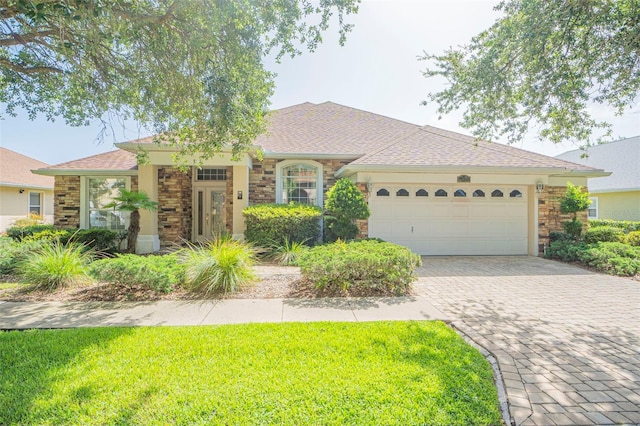 ranch-style home featuring a garage