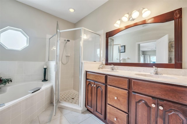 bathroom featuring tile patterned floors, separate shower and tub, and vanity