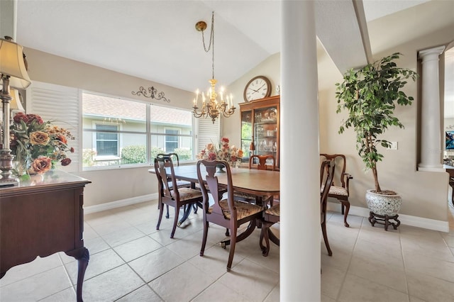 dining area with lofted ceiling, light tile patterned floors, decorative columns, and a chandelier