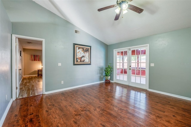 empty room with high vaulted ceiling, dark wood-type flooring, ceiling fan, and french doors