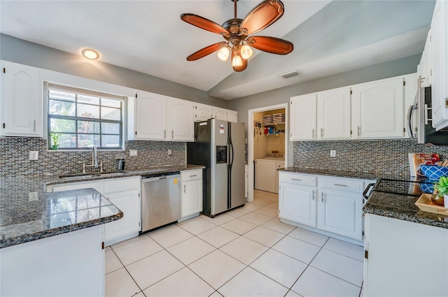 kitchen with stainless steel appliances, white cabinetry, and sink