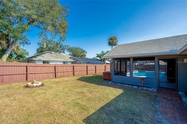 view of yard featuring a sunroom