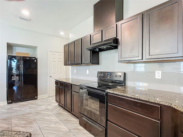 kitchen with light stone counters, backsplash, dark brown cabinets, and black appliances