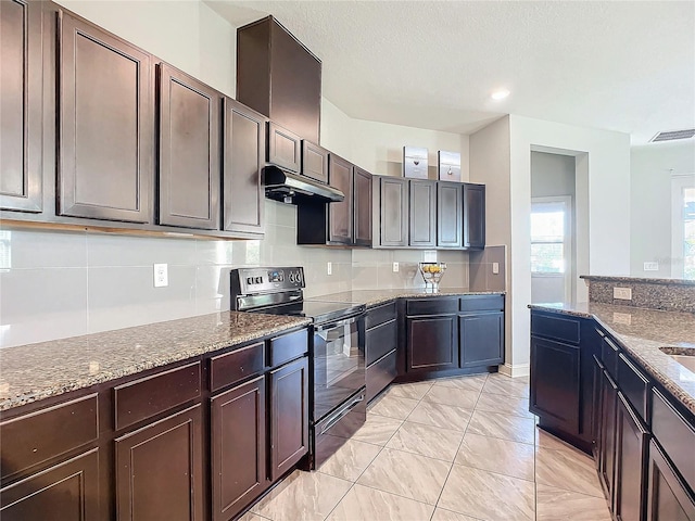 kitchen with range with electric cooktop, dark brown cabinets, and light stone counters