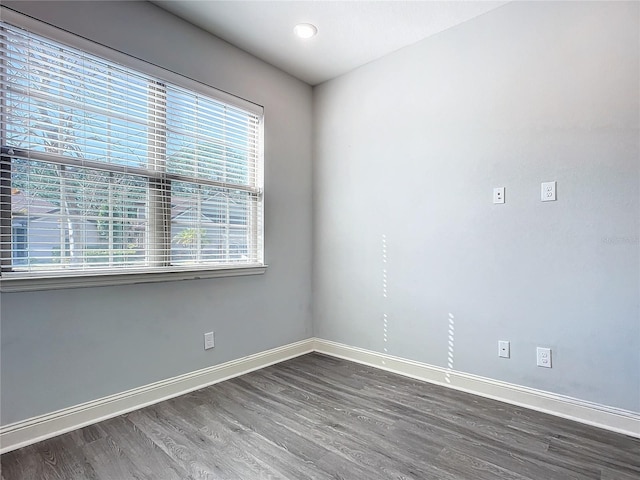 spare room featuring dark hardwood / wood-style floors