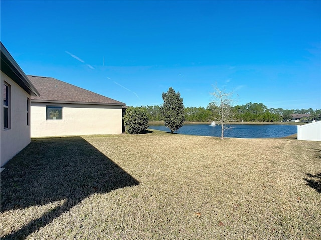 view of yard with a water view