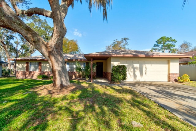 view of front of home featuring a garage and a front yard