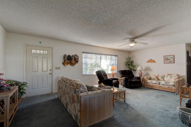 carpeted living room featuring ceiling fan and a textured ceiling