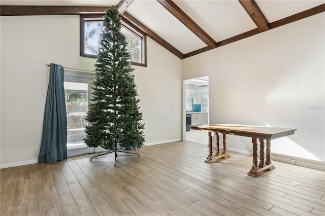 1240 W Voorhis Ave, Deland, FL 32720 - interior space with beam ceiling, wood finished floors, plenty of natural light, and high vaulted ceiling