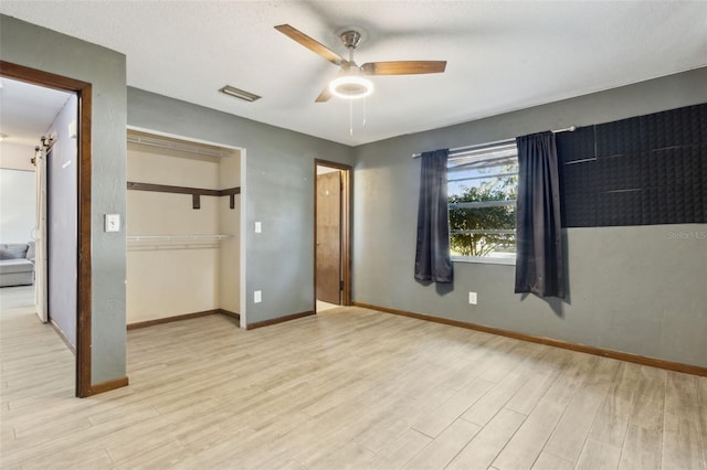 1240 W Voorhis Ave, Deland, FL 32720 - unfurnished bedroom with baseboards, visible vents, and wood finished floors