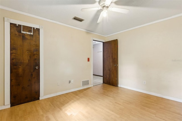 1240 W Voorhis Ave, Deland, FL 32720 - unfurnished bedroom featuring visible vents, light wood-type flooring, ornamental molding, and baseboards
