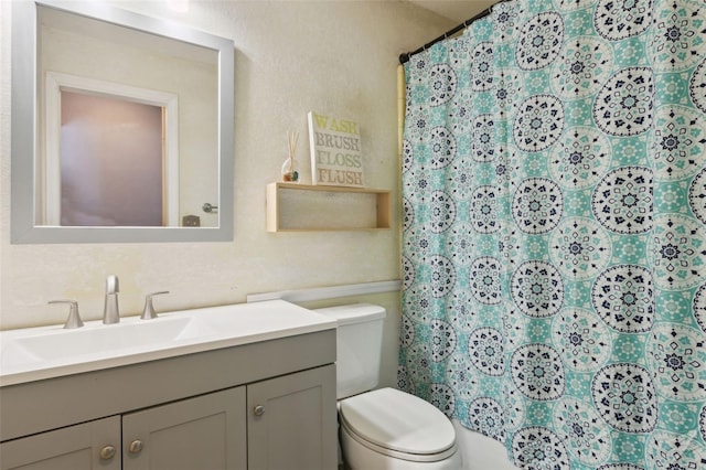 1240 W Voorhis Ave, Deland, FL 32720 - full bathroom with vanity, toilet, and a shower with shower curtain