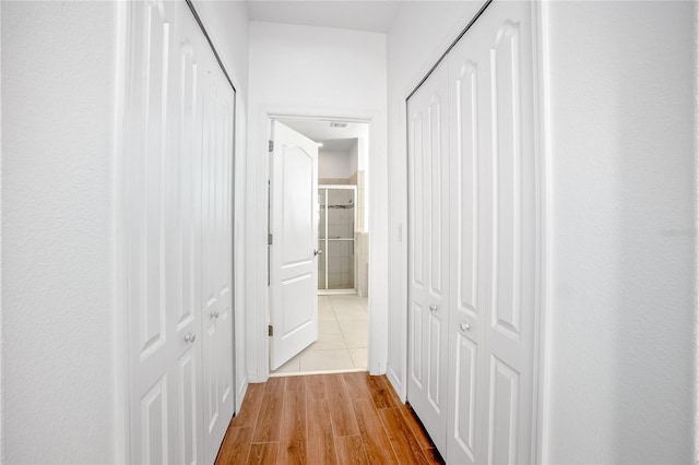 hallway featuring light hardwood / wood-style flooring