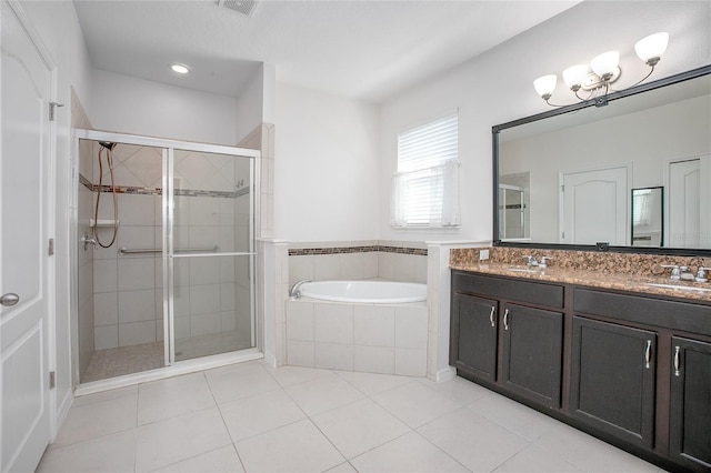 bathroom with vanity, tile patterned flooring, and shower with separate bathtub