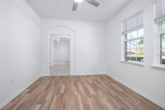 spare room with ceiling fan and light hardwood / wood-style floors