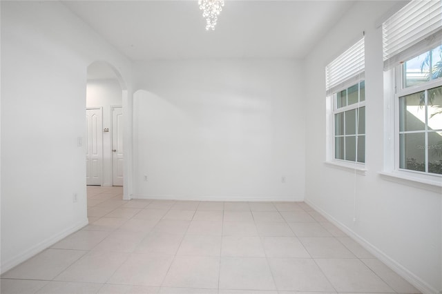 unfurnished room with light tile patterned floors