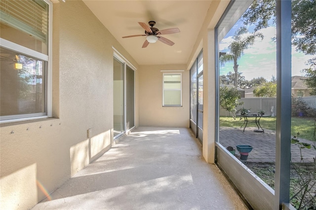 sunroom / solarium with ceiling fan