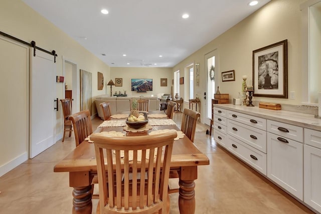 dining area with a barn door