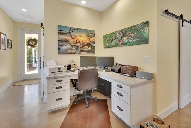 office featuring a barn door