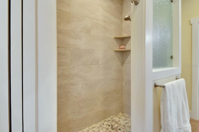 bathroom featuring tiled shower