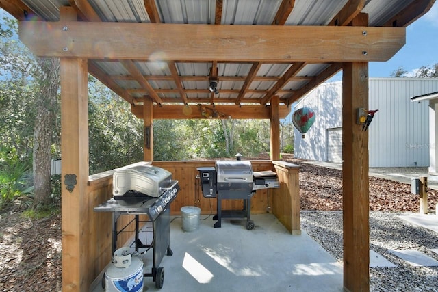 view of patio featuring a grill