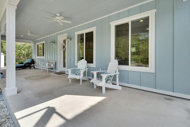 view of patio with ceiling fan and a porch