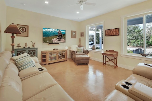 living room with ceiling fan and plenty of natural light