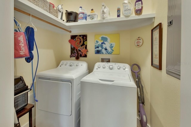 clothes washing area with independent washer and dryer