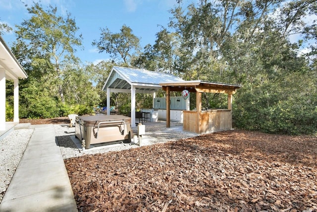 view of patio with a hot tub