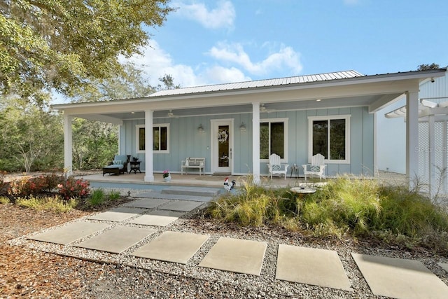 back of property featuring a porch