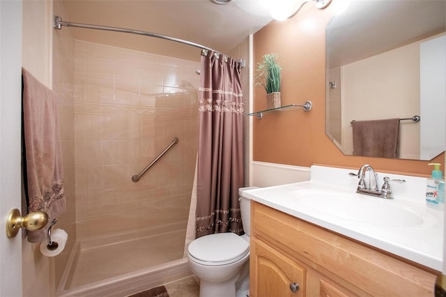 bathroom with vanity, toilet, and walk in shower