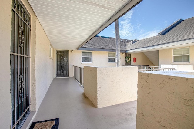 view of patio featuring a balcony