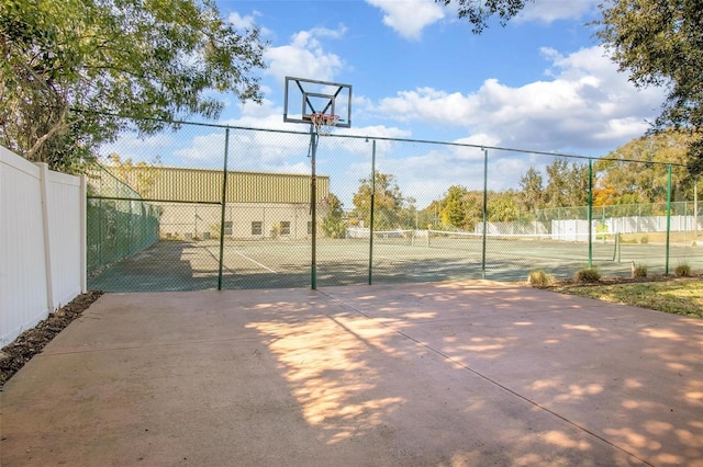 view of basketball court featuring tennis court