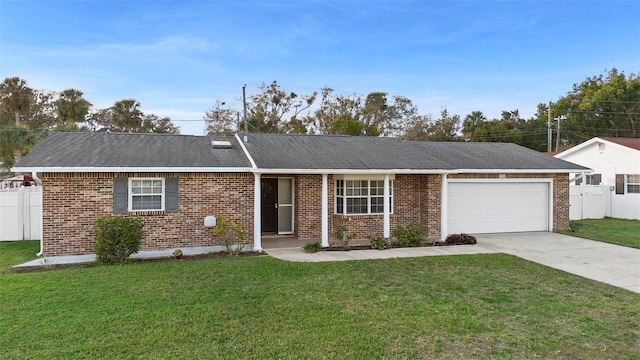 single story home featuring a garage and a front yard