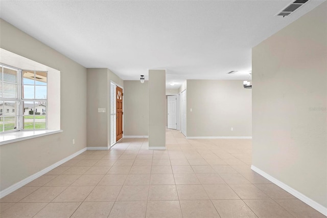 empty room featuring light tile patterned floors