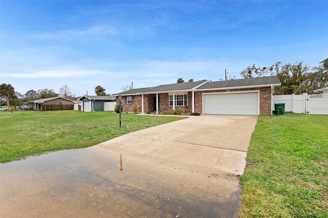 single story home featuring a garage and a front lawn