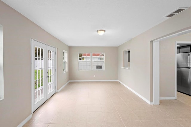 tiled empty room with a wealth of natural light