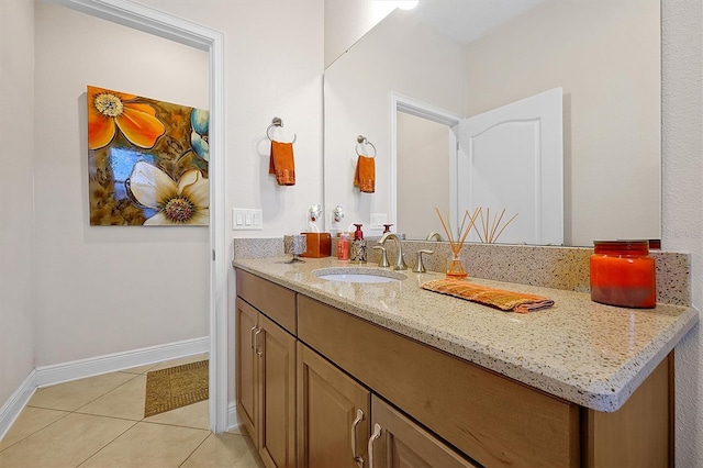 bathroom with tile patterned flooring and vanity