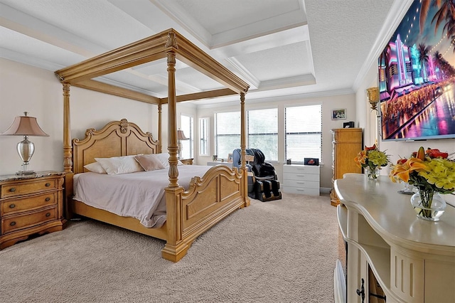 carpeted bedroom with ornamental molding and a textured ceiling