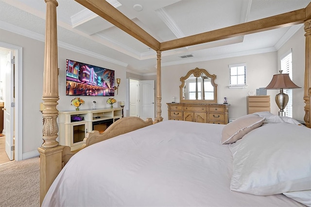 carpeted bedroom with crown molding and decorative columns