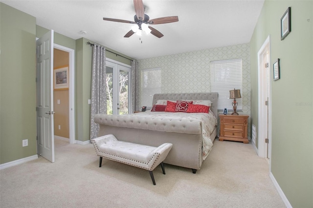 carpeted bedroom featuring french doors and ceiling fan