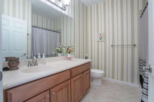 bathroom featuring tile patterned floors, toilet, and vanity