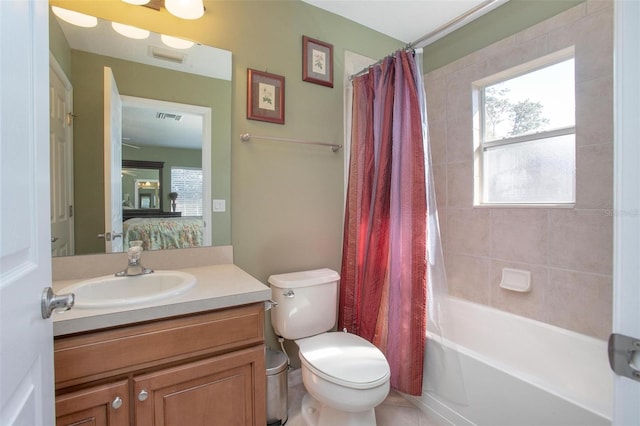 full bathroom featuring vanity, toilet, and shower / bath combo with shower curtain