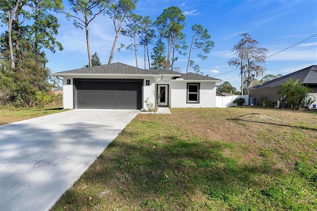 ranch-style home with a garage, cooling unit, and a front lawn